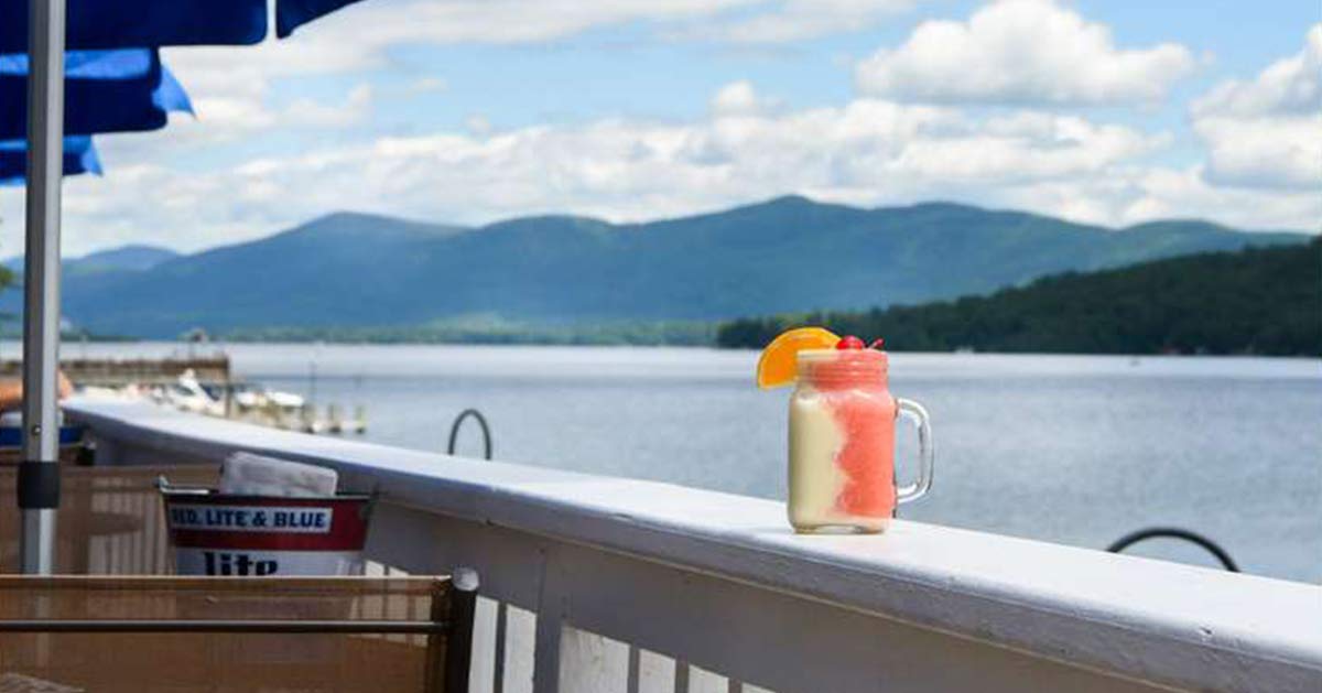 A drink on the railing of Lake George beach club.