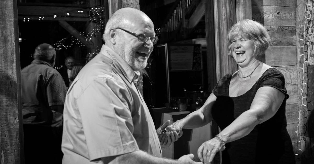 black and white photo of couple dancing at a wedding